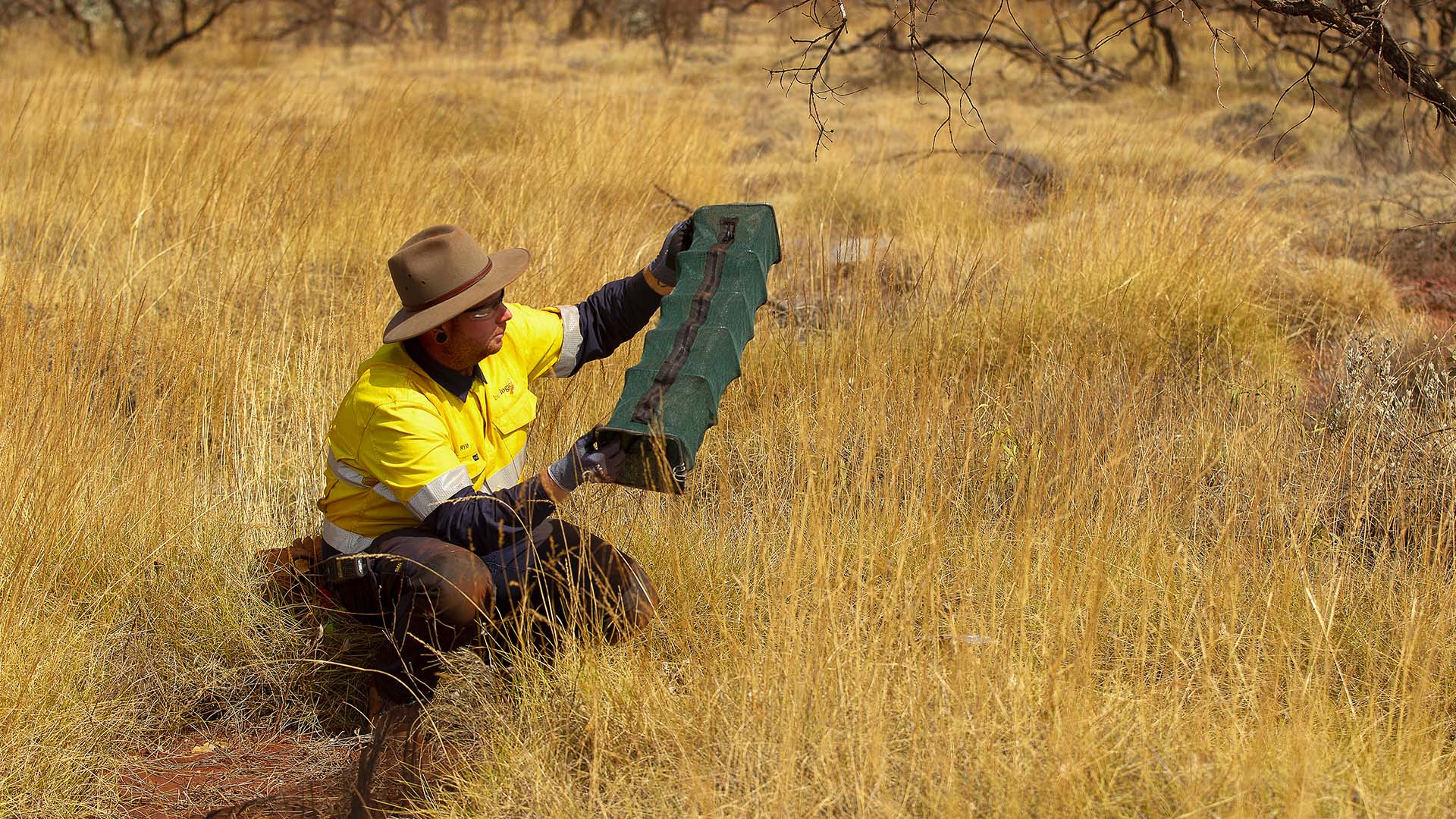 Worker from Biologic conducting environmental survey at Angelo River