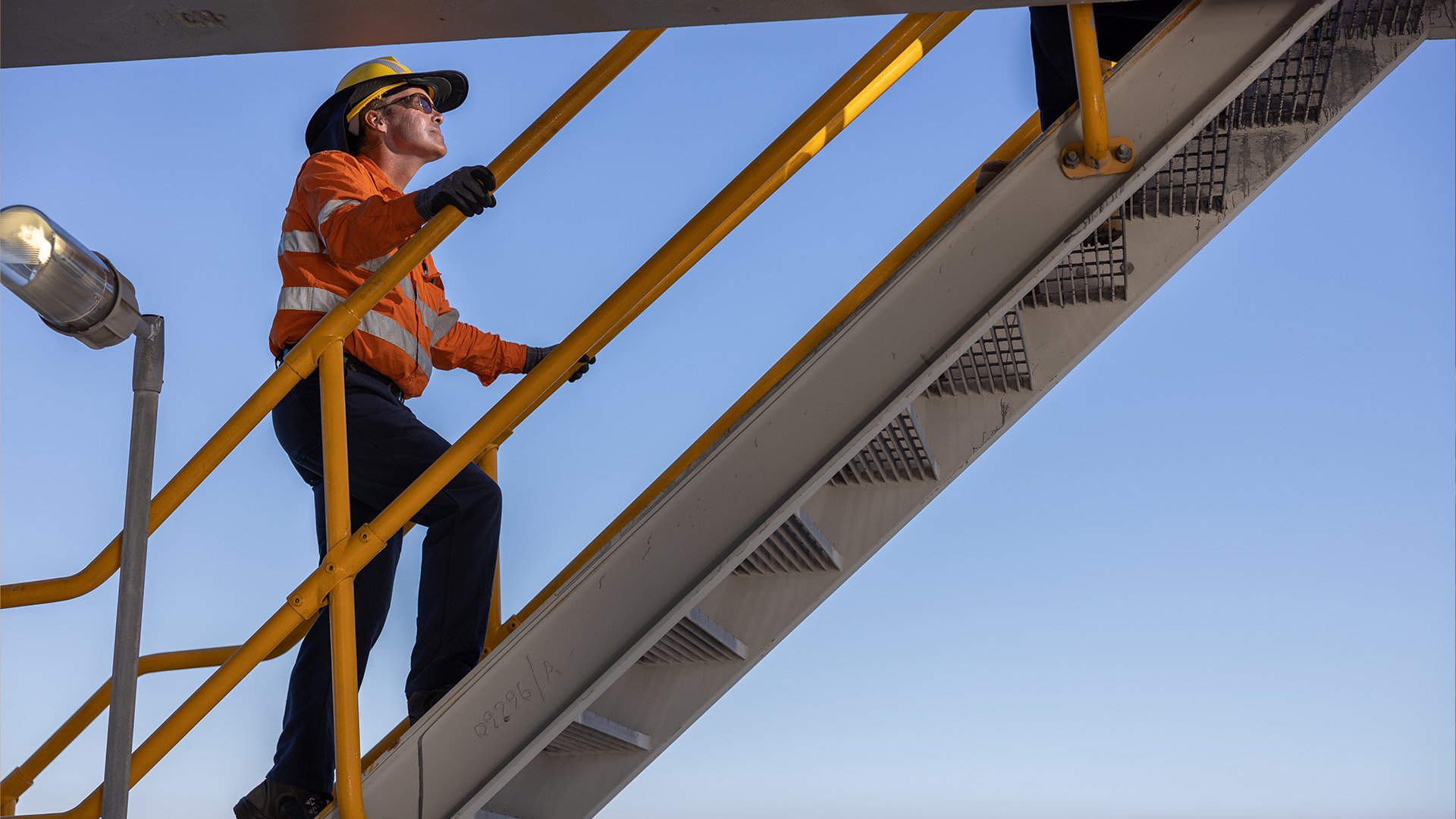 Employee ascending the stairs at the wharf area, BSL