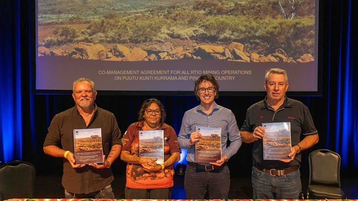 Pinikura Traditional Owner and Chairperson of PKKP Aboriginal Corporation, Terry Drage, Puutu Kunti Kurrama Traditional Owner and Director, Sandra Hayes together with Rio Tinto Iron Ore Chief Executive, Simon Trott, and Rio Tinto Iron Ore General Manager, Tim Eckersley, signing the new Co-Management Agreement in Karratha, 22 May 2025.