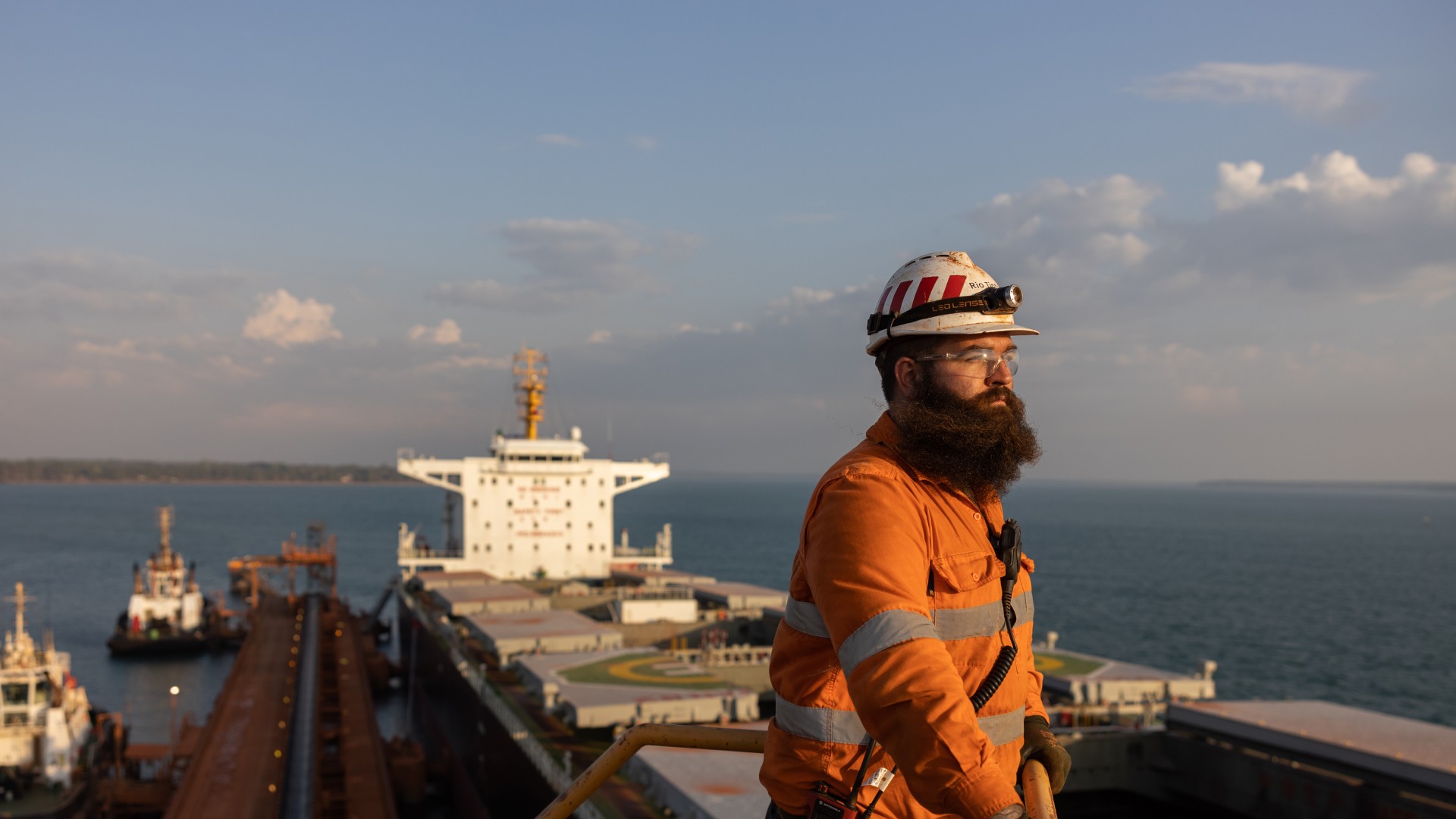 A man on ship looking at the sea
