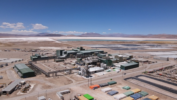Aerial view of Lithium mine operations showing heavy vehicles, machinery and storage facilities.