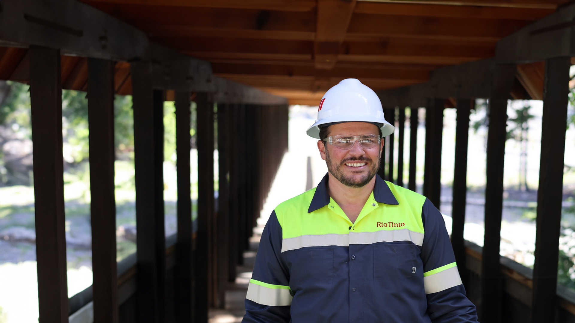 Roney, our Senior Manager of Rio Tinto Closure posing for camera wearing a safety hat and jacket in the United States