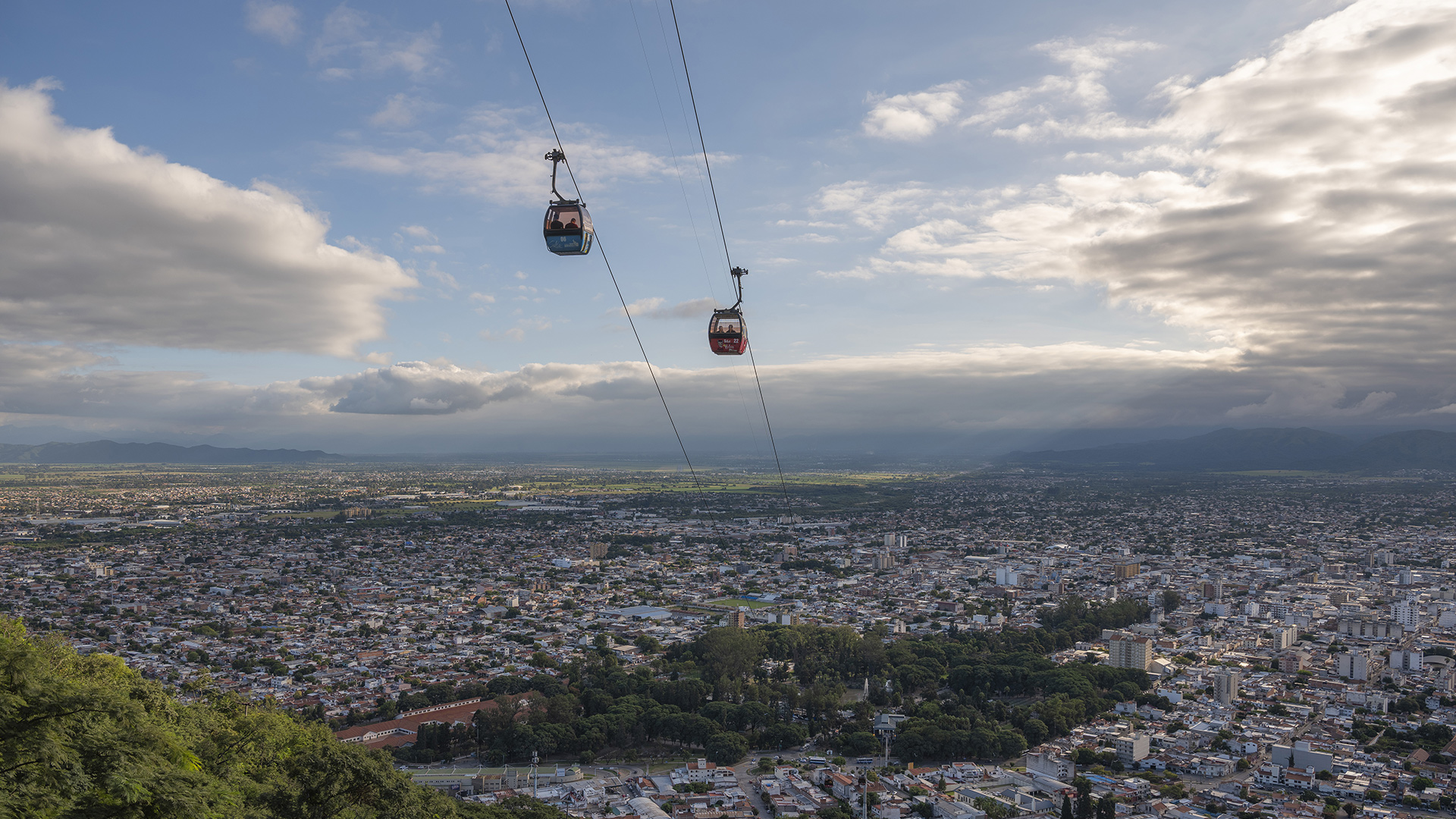 Aerial shot of two cable cars moving in South America