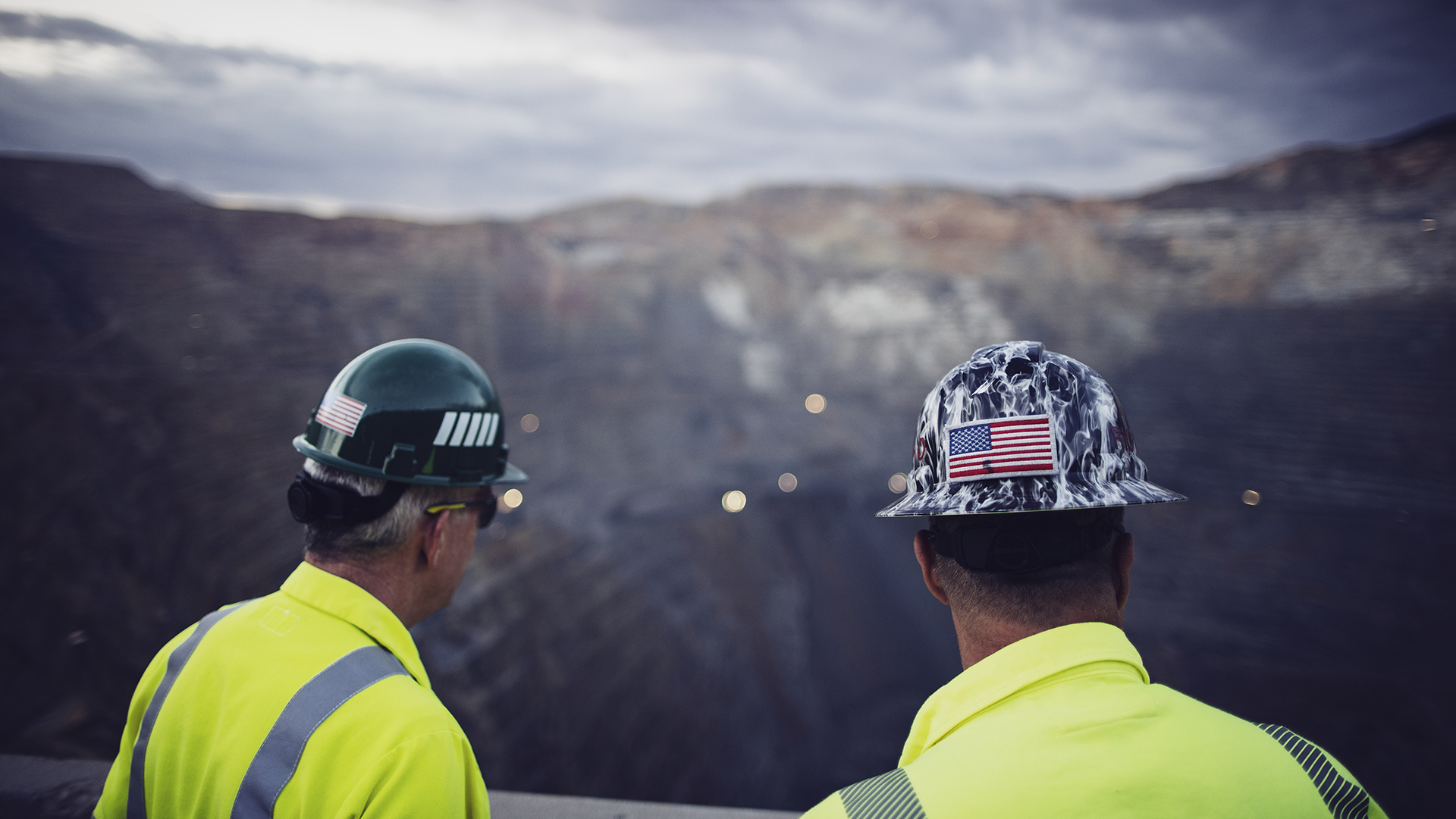 Two employees looking out at Rio Tinto Kennecott mine
