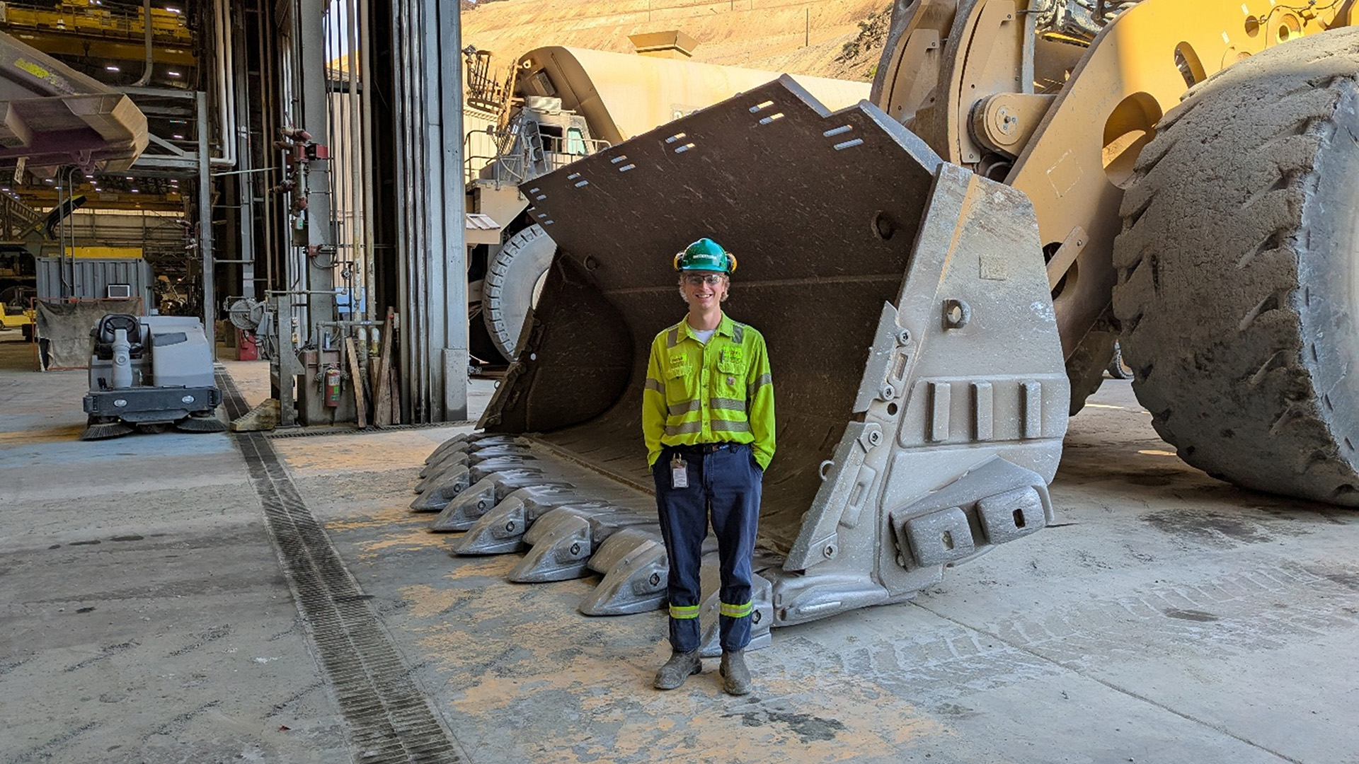 Pat in front of a truck