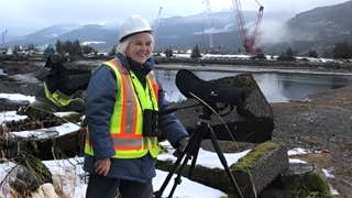 April - the naturalist standing in front of a camera wearing high visibility vest.